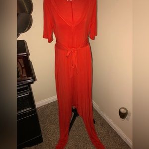 Beautiful orange, harem style jumpsuit with attached belt and pockets.
